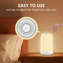 Tap the top of the bedside lamp to adjust brightness and colour