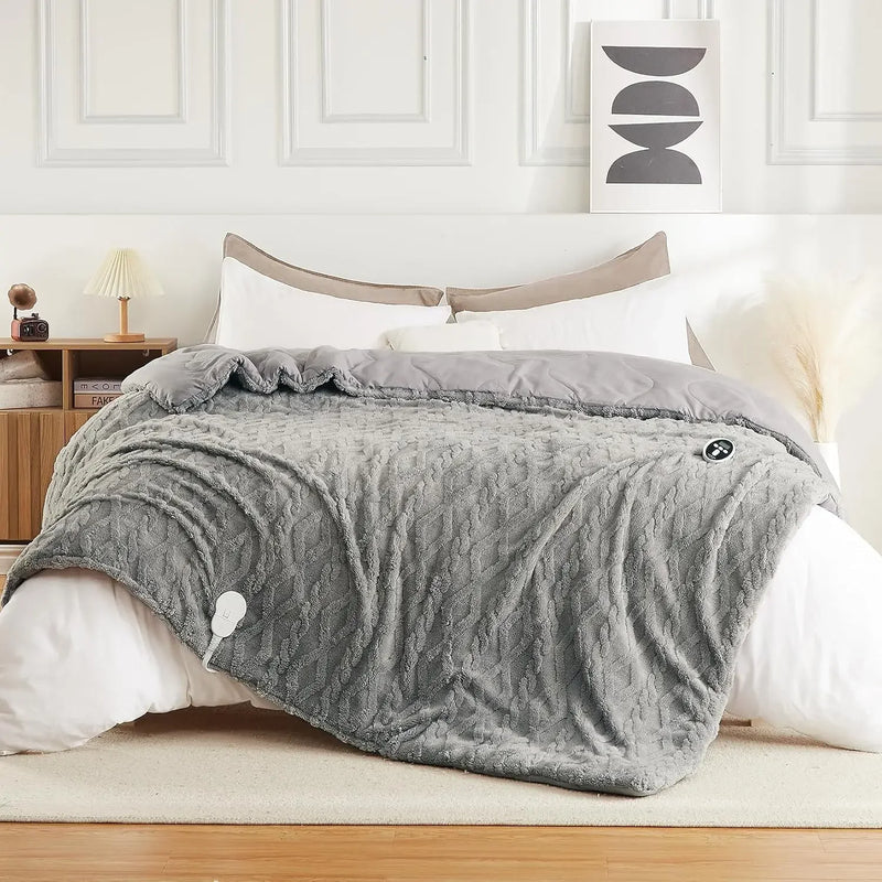 Grey heated comforter on a queen bed
