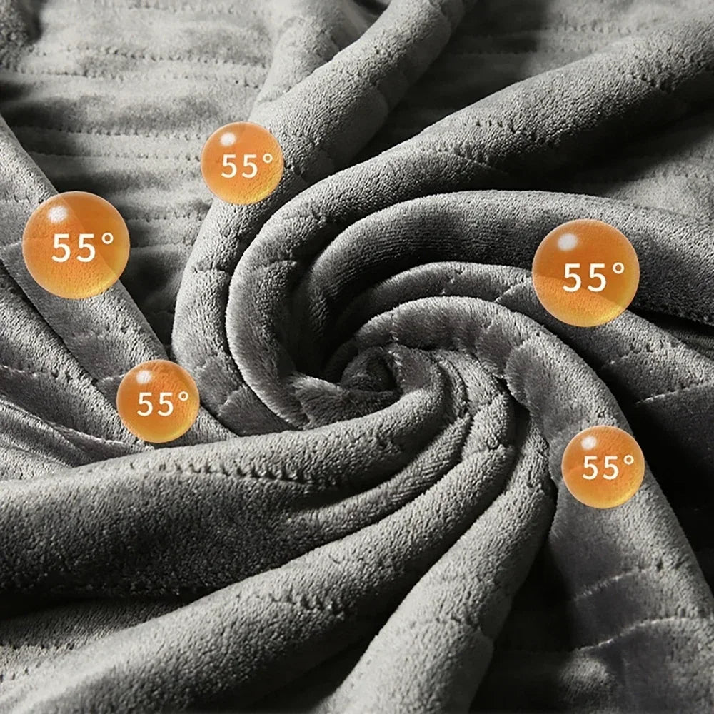 Heated flannel blanket fabric with heat-zone indicators across the surface