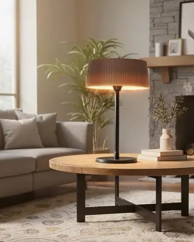 Bronze tabletop patio heater beside a sofa in a living room