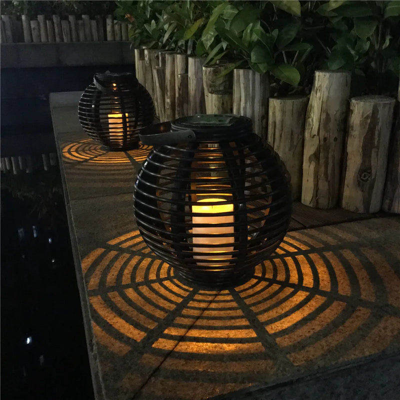 Solar rattan-style globe lantern with LED candle