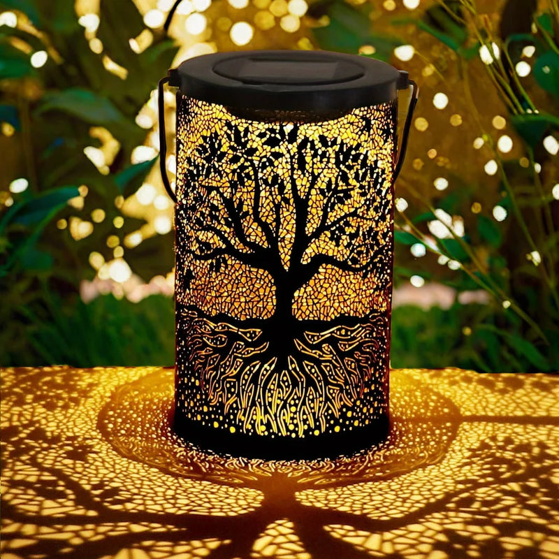 Vintage metal solar lantern with tree-of-life cut-out