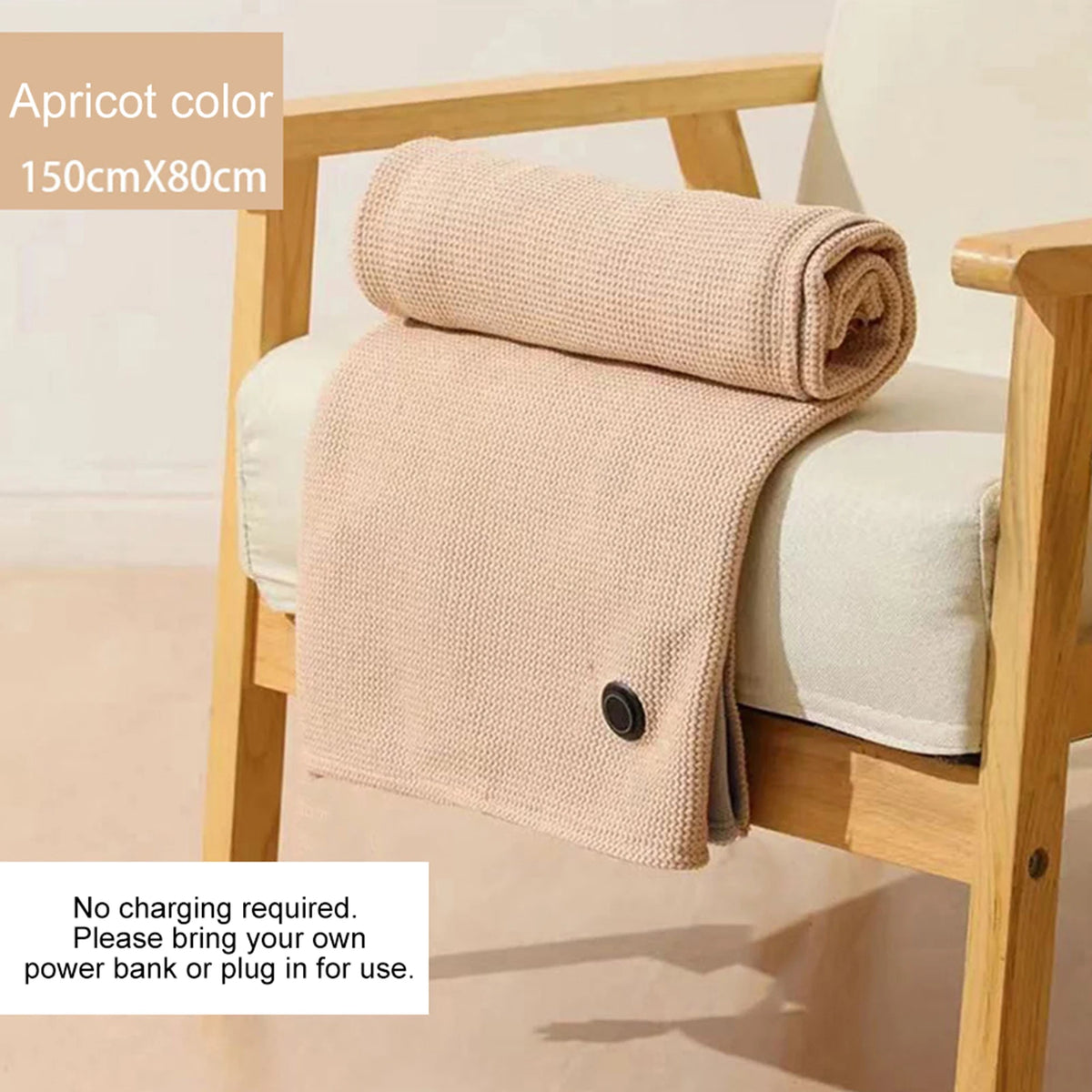 Apricot heated shawl wrap over a wooden chair, noting it runs from a power bank or mains