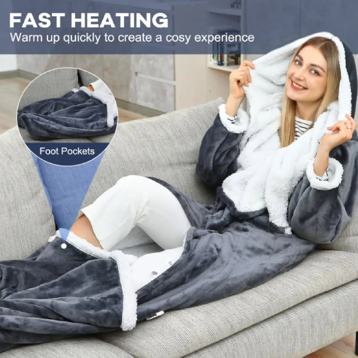 Hooded wearable heated blanket with foot pockets in use on a sofa