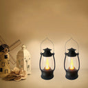 Two black mini hurricane lanterns with LED tealights