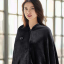 Woman wearing a dark gray USB heated shawl wrap
