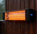 Wall-mounted infrared patio heater on an outdoor wooden wall in the rain