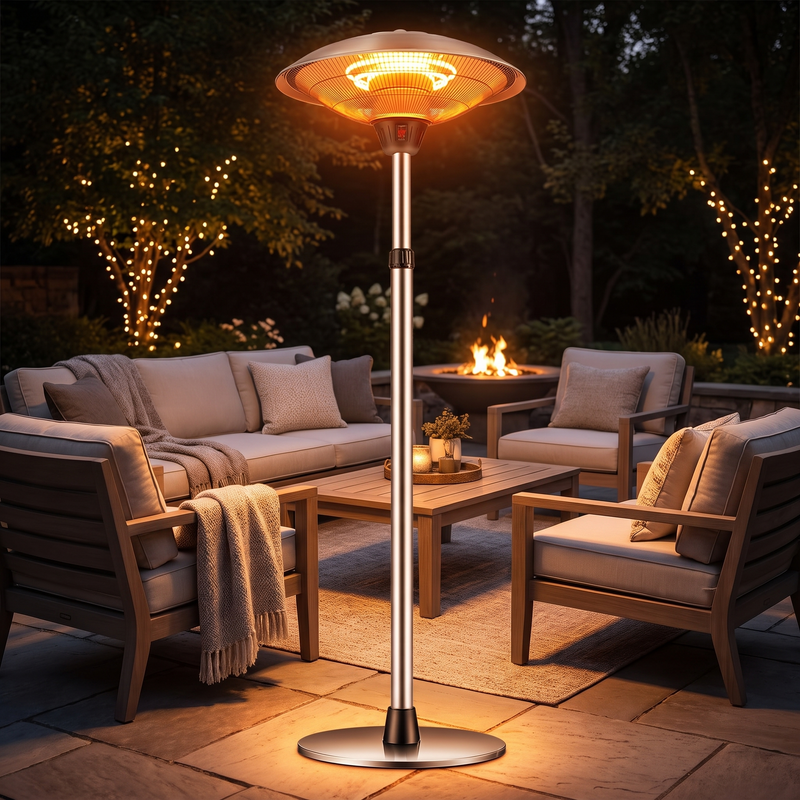 Umbrella-style stainless steel patio heater glowing on a hotel terrace in the evening
