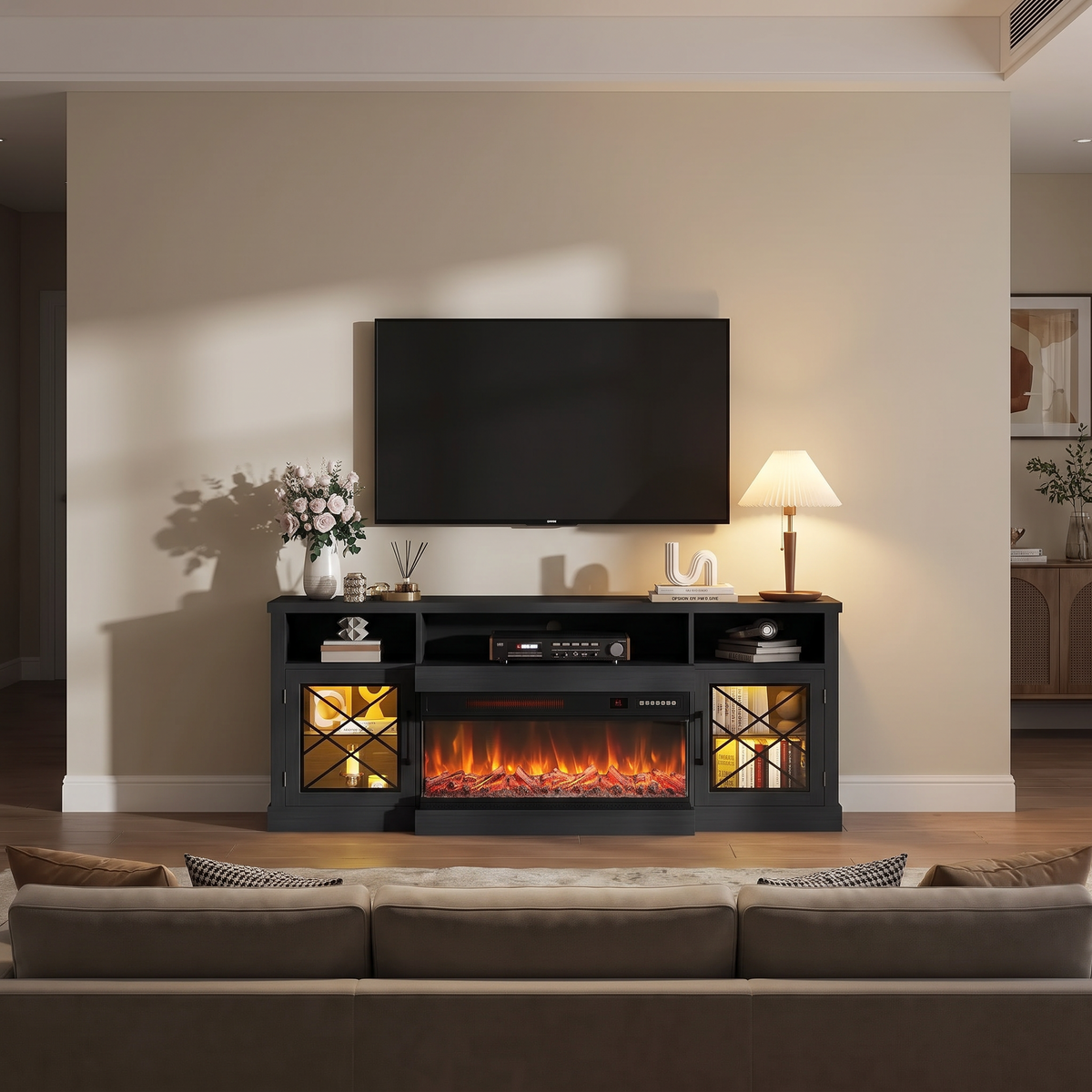 65 Inch Electric Fireplace TV Stand for TVs up to 75 Inch, 3-Sided Glass, Modern Media Console Entertainment Center for Living Rooms viewed across a furnished room, showing its scale against the wall