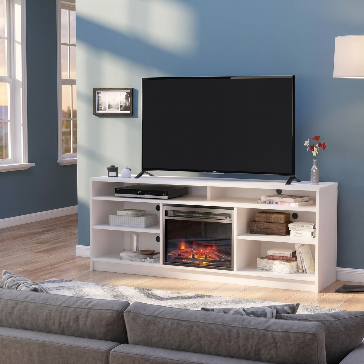 65 Inch Electric Fireplace TV Stand, Modern Media Console Entertainment Center, Storage Cabinets for Living Rooms viewed across a furnished room, showing its scale against the wall