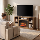 Electric Fireplace TV Stand for TVs up to 65 Inch, Modern Media Console Entertainment Center for Living Rooms and Apartments shown in a styled living room with a person relaxing nearby