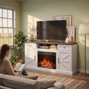 Farmhouse Fireplace TV Stand for TVs up to 70 Inch, Entertainment Center with 23 Inch Electric Fireplace, Drawers & Storage, Antique White shown in a styled living room with a person relaxing nearby
