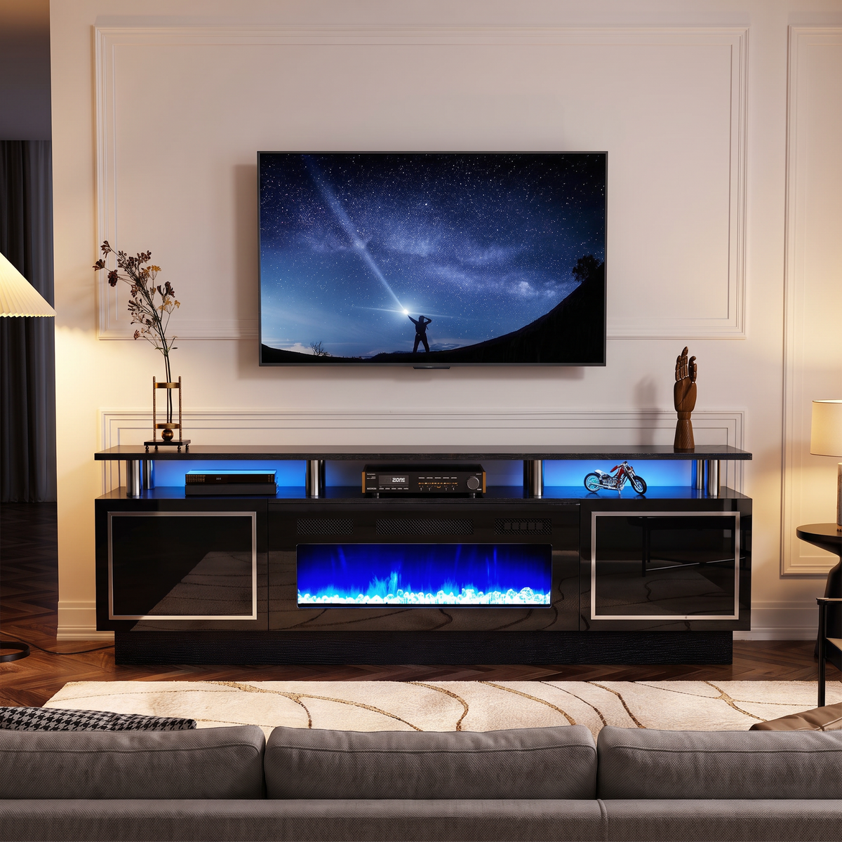 Double-Tier Electric Fireplace TV Stand for TVs up to 80 Inch with LED Lights, Black Two-Level Media Console viewed across a furnished room, showing its scale against the wall