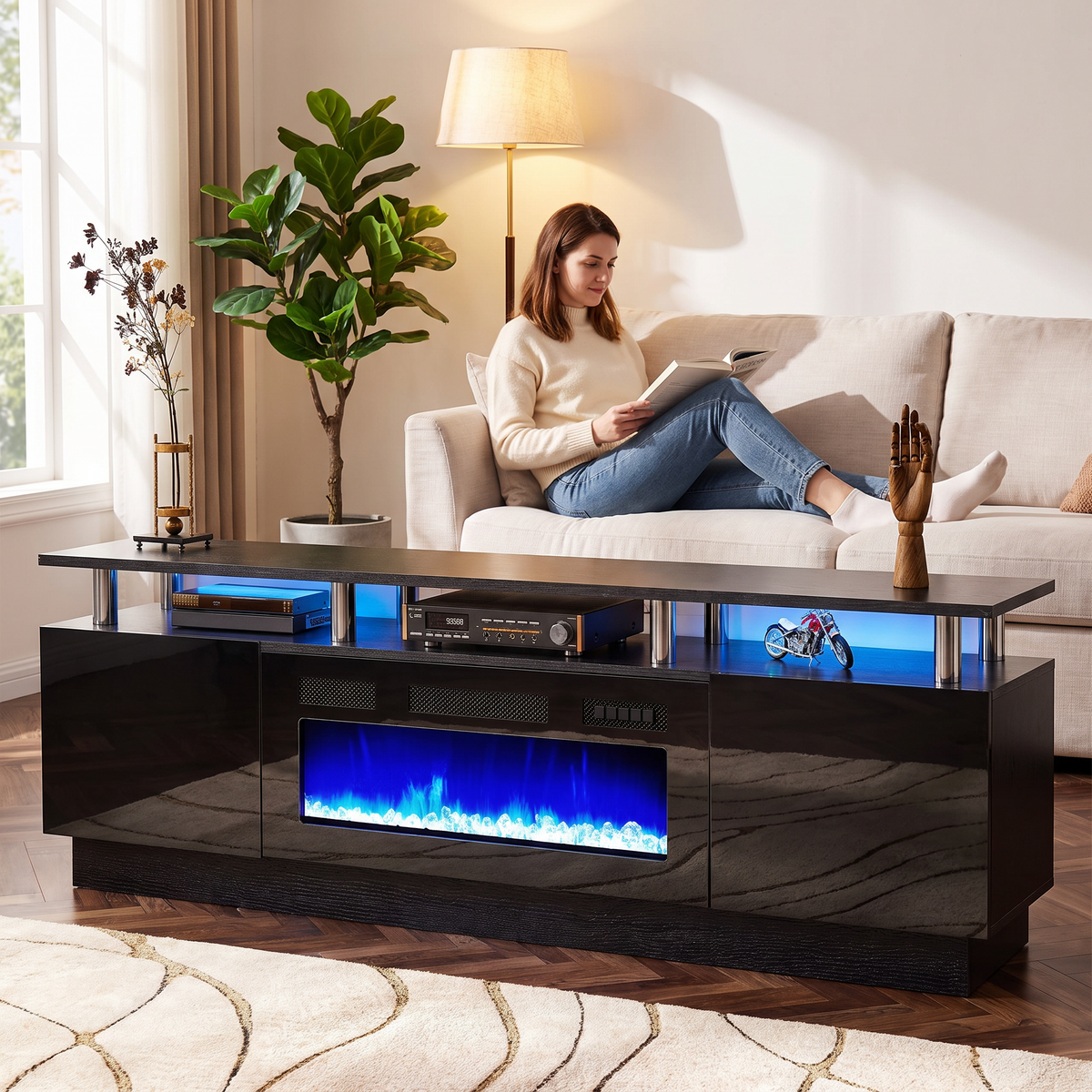 Double-Tier Electric Fireplace TV Stand for TVs up to 80 Inch with LED Lights, Black Two-Level Media Console shown in a styled living room with a person relaxing nearby