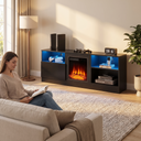 Electric Fireplace TV Stand for TVs up to 65 Inch, 18" Firebox for Living Rooms shown in a styled living room with a person relaxing nearby