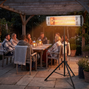Far-Infrared Wall-Mounted Outdoor Heater, Waterproof Electric Heater for Patio, Restaurant & Covered Areas shown in a styled living room with a person relaxing nearby
