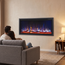 60 Inch Recessed Electric Fireplace, 750W/1500W Wall-Mounted Linear Fireplace with Smart Heat & Adjustable Flame shown in a styled living room with a person relaxing nearby