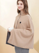 Woman wearing the apricot USB heated shawl blanket zipped at the front, holding a bowl
